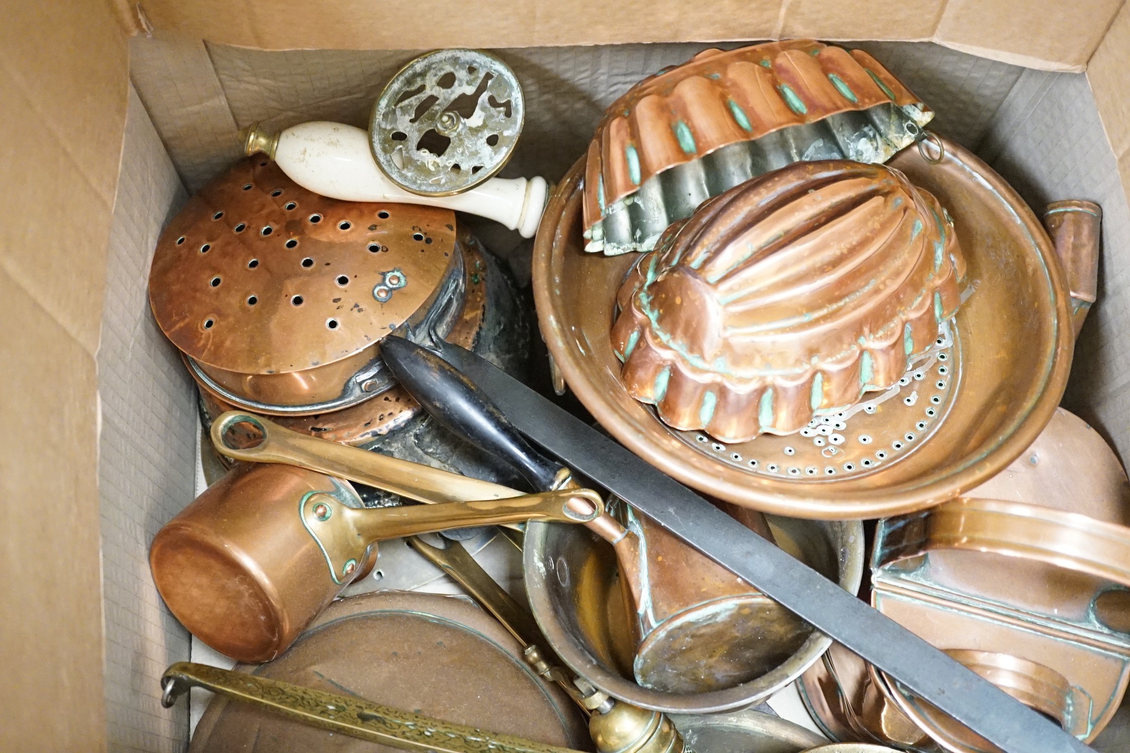 A quantity of various copper and brass to include jelly moulds, trivets, watering cans etc.